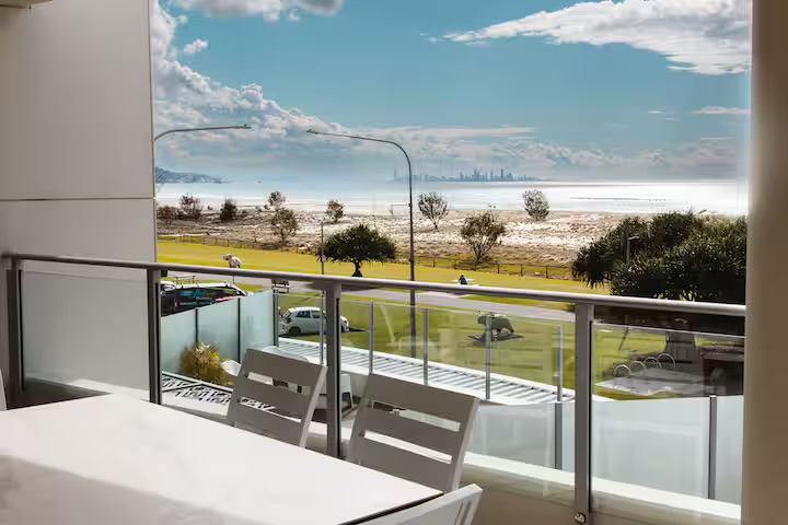 Living room and ocean outlook at Casa d' Mar, absolute beachfront at Kirra Beach, Coolangatta — photo 6 of 8