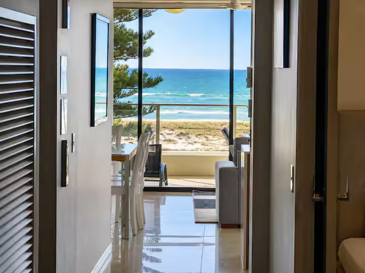 Living room and ocean outlook at Casa d' Mar, absolute beachfront at Kirra Beach, Coolangatta — photo 4 of 8